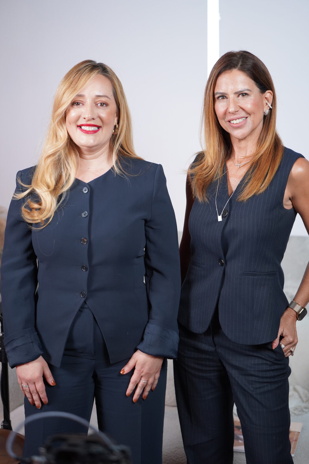 Marcie Gregorio with a fellow woman leader in Miami real estate